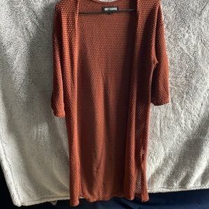 Sweet and Sinful orange sweater